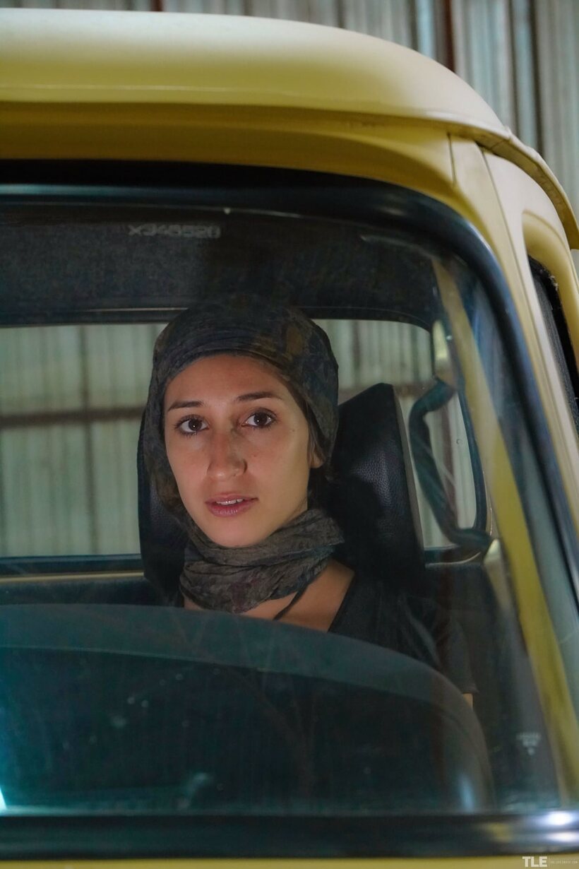 In a truck, Carol O strokes her pussy and shows off that ass (shot 1)