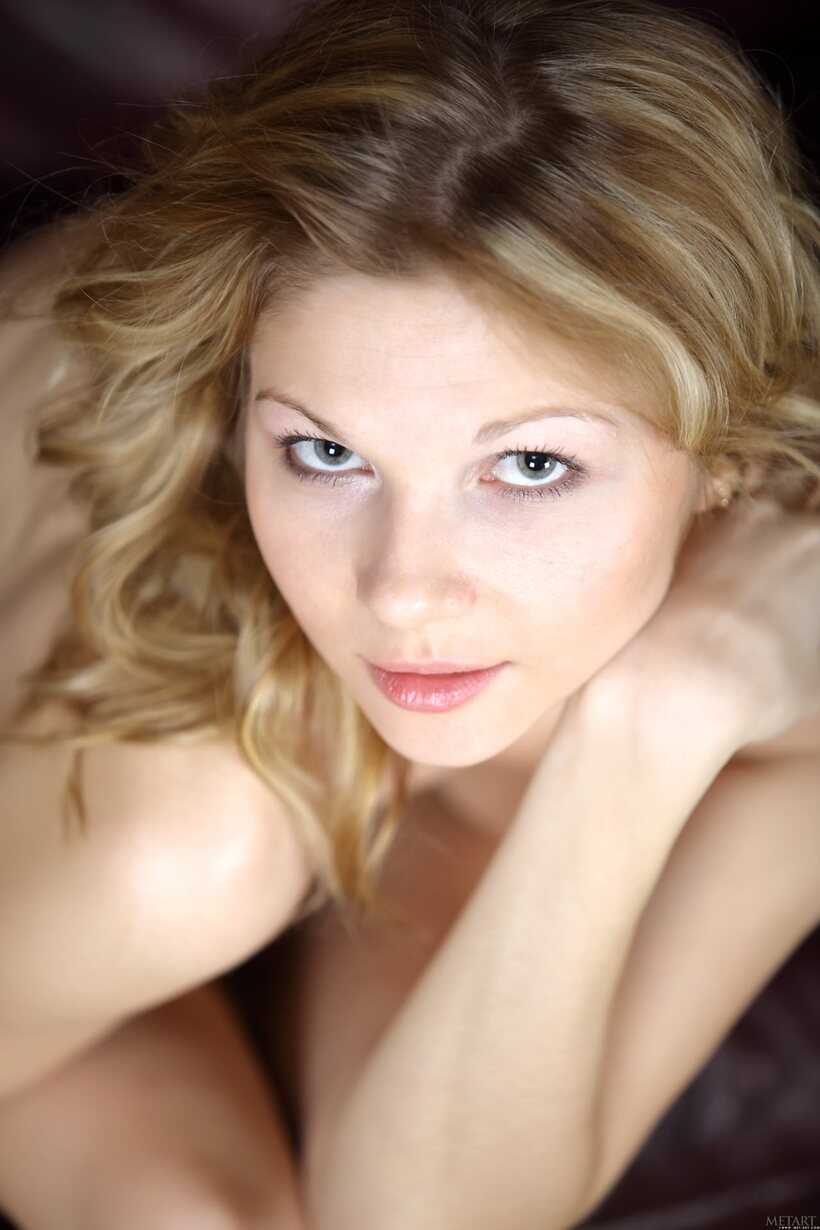 Beautiful pic 18 from the set «Blonde beauty undresses on a leather sofa and poses nude»