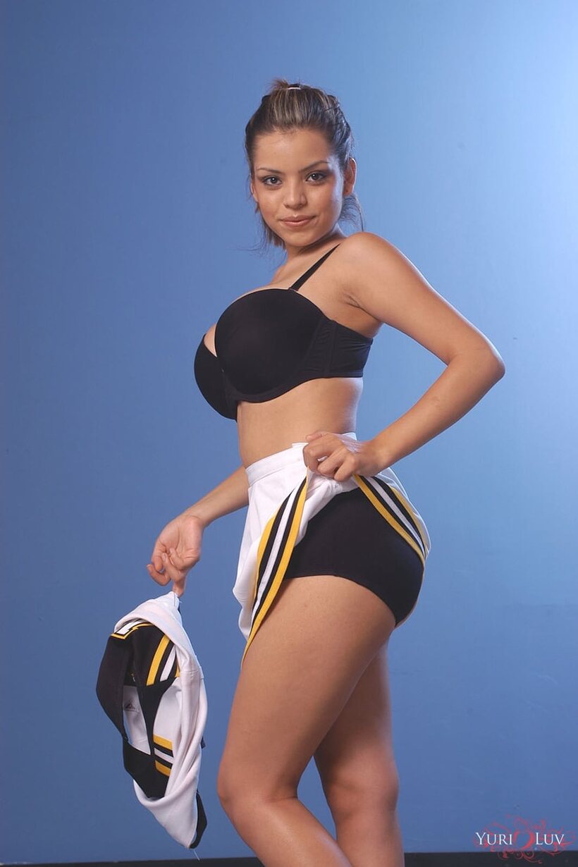 Stripping down, Yuri Luv shows off her huge tits in uniform, photo 3 of 20