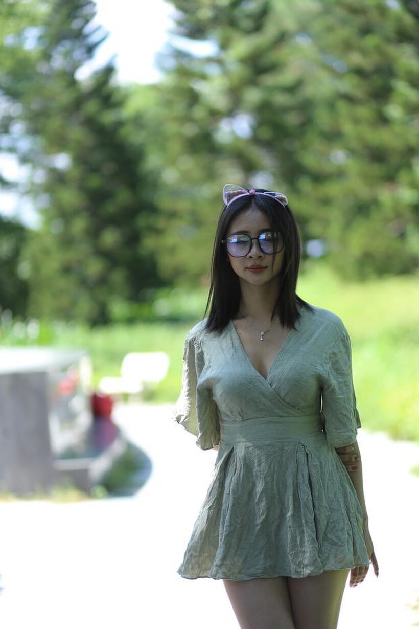Photo 2 — Beautiful girl in a skirt shows her ass outdoors
