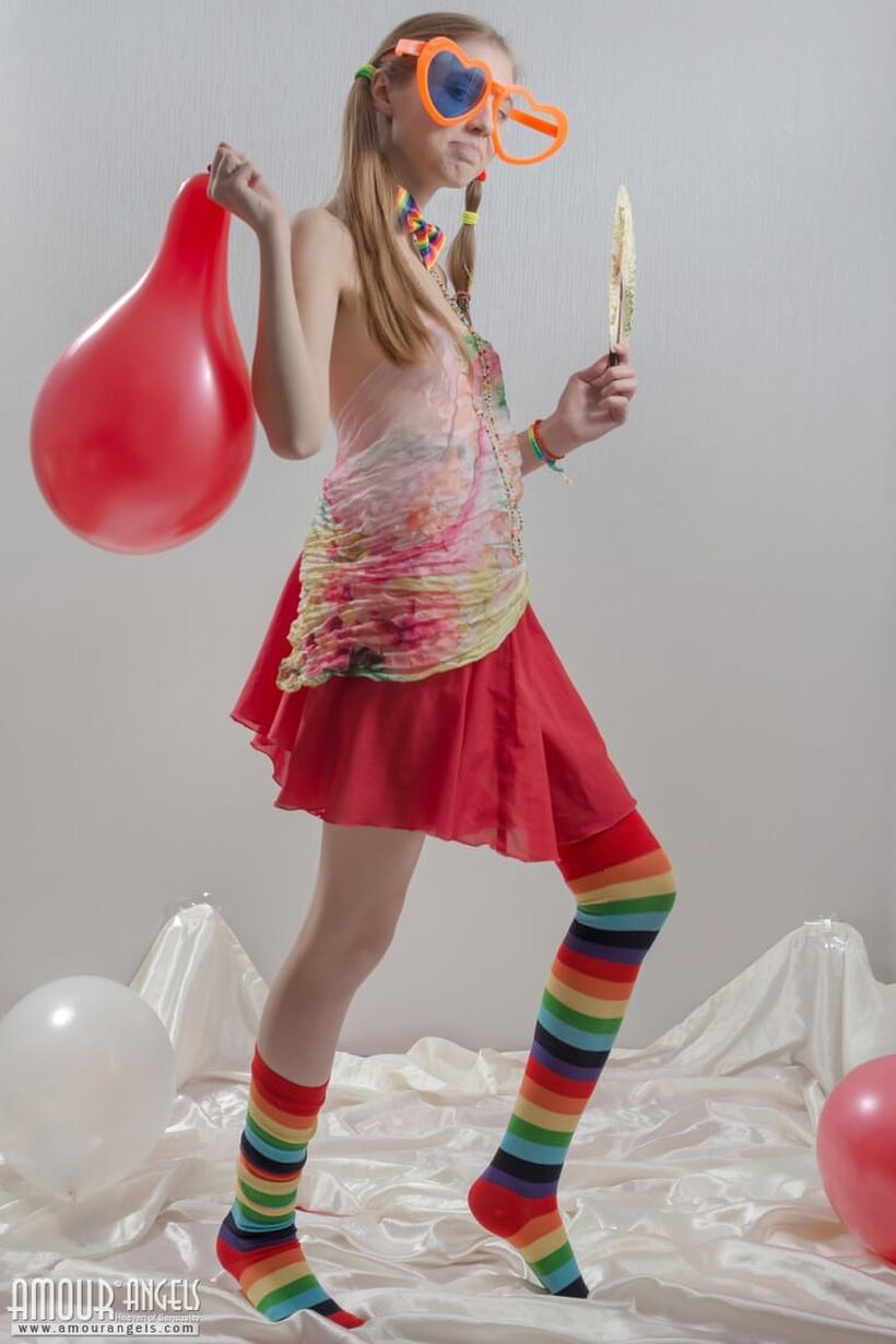 Ass pic 2 from the set «Pigtail teen in colorful socks strips off her clothes»
