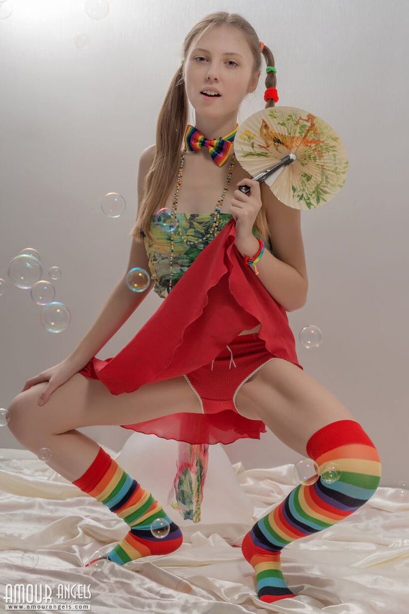 Pigtail teen in colorful socks strips off her clothes (shot 6)