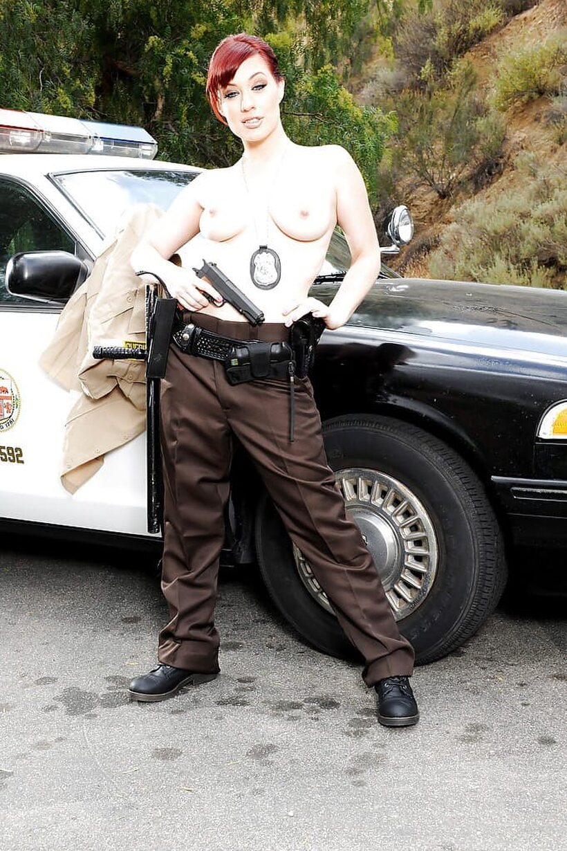 Jessica Ryan sheds her police uniform for an outdoor strip tease (shot 8)
