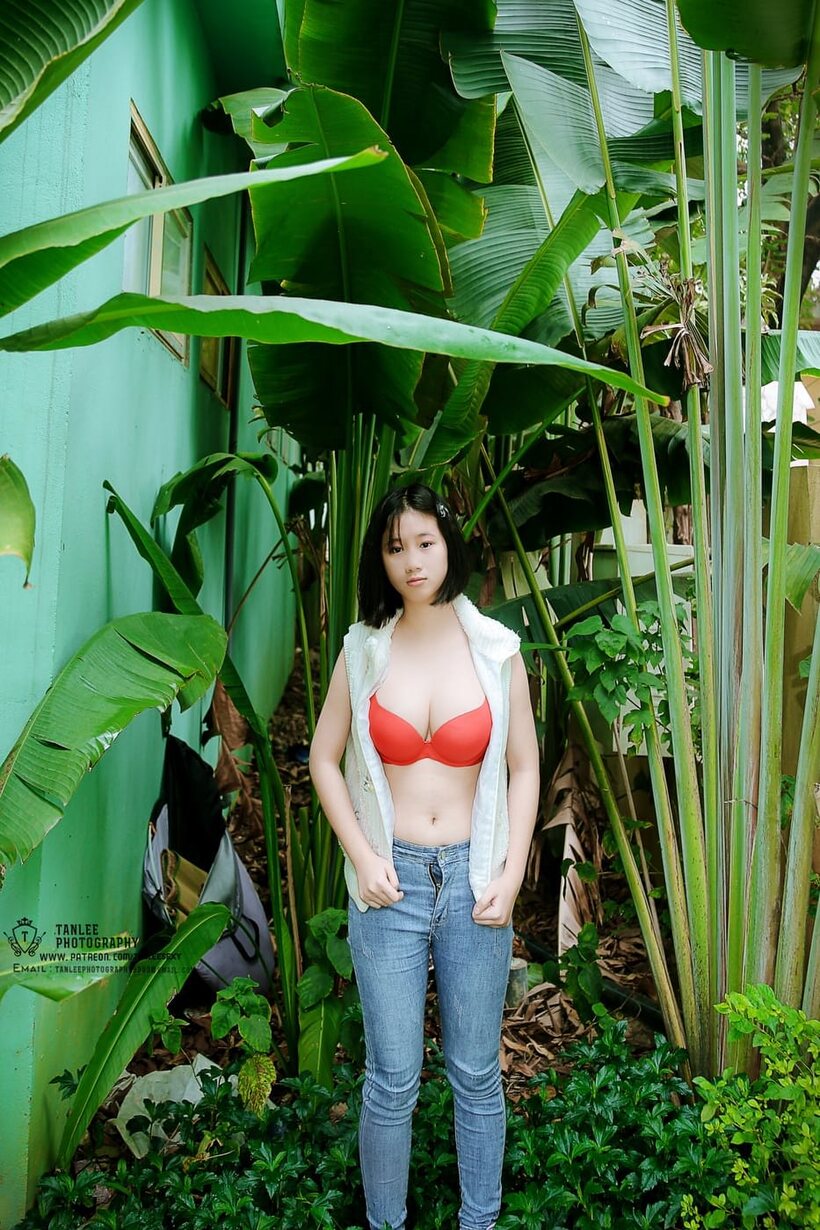 Photo 12 — Amateur girl strips out of her jeans and poses naked