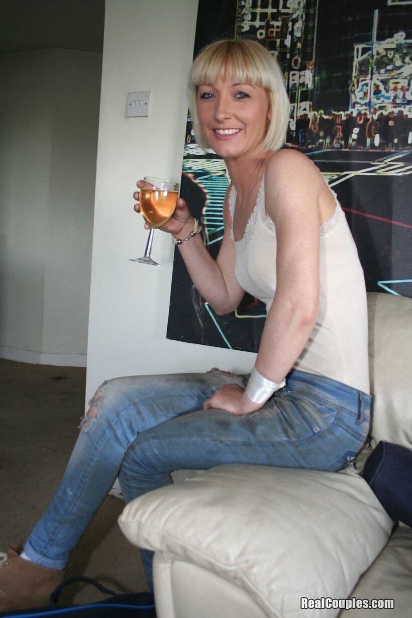 Roemie strips her jeans, shows off her small tits and ass, then rides cock, photo 1 of 21
