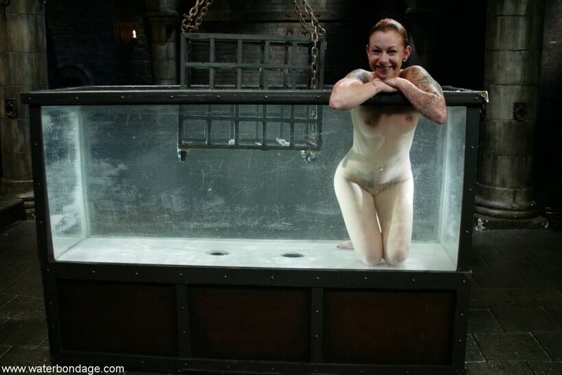 Photo 16 — Redhead Scarlett Pain shows her natural tits tied up