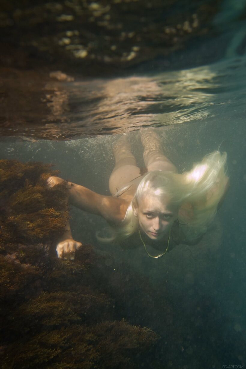 Photo 2 — Nika N rises from the water and poses nude as a platinum blonde teen