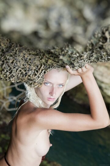 Nika N rises from the water and poses nude as a platinum blonde teen