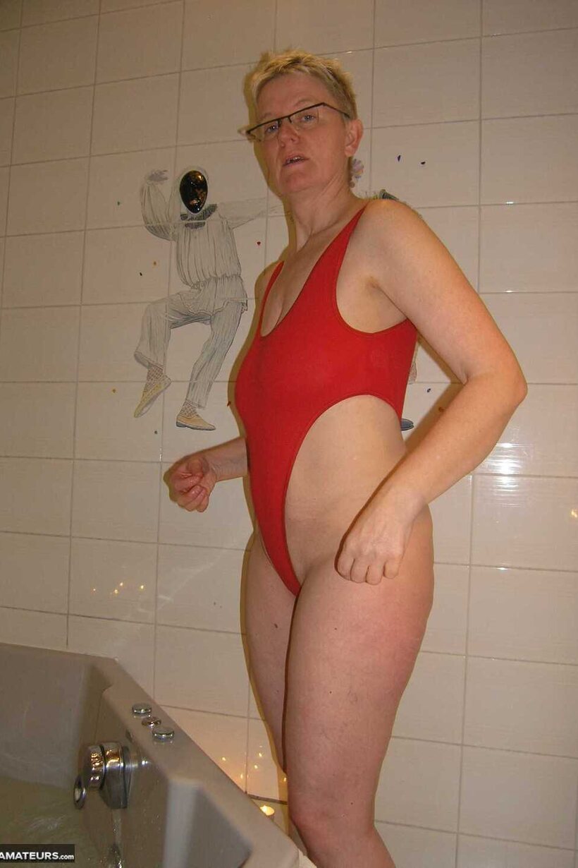 Image 10/16: Blonde Tiffany Pearl up close: wet pussy and legs in a micro bikini