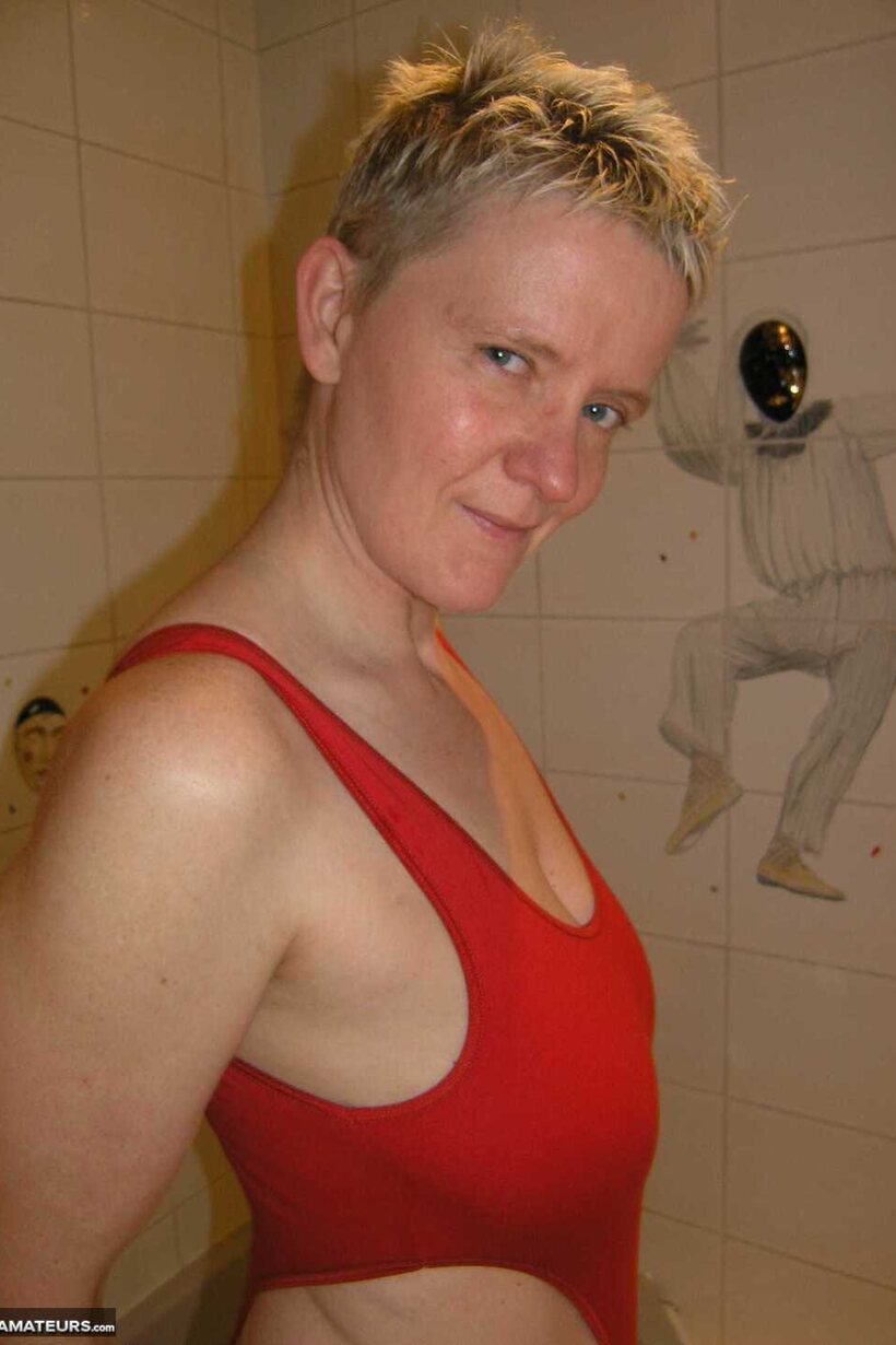 Blonde Tiffany Pearl up close: wet pussy and legs in a micro bikini, photo 12 of 16