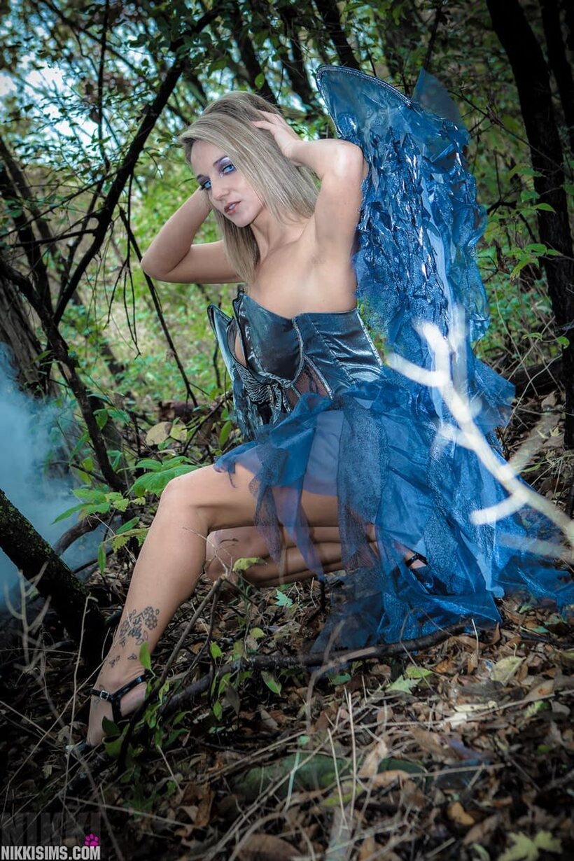 Photo 4 — Nikki Sims drops the fairy wings and poses in a thong