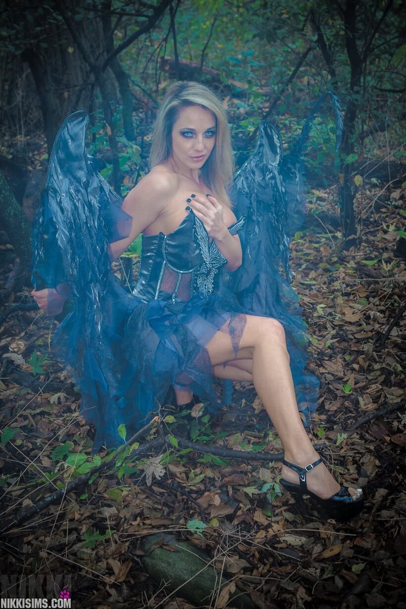 Nikki Sims drops the fairy wings and poses in a thong (shot 11)