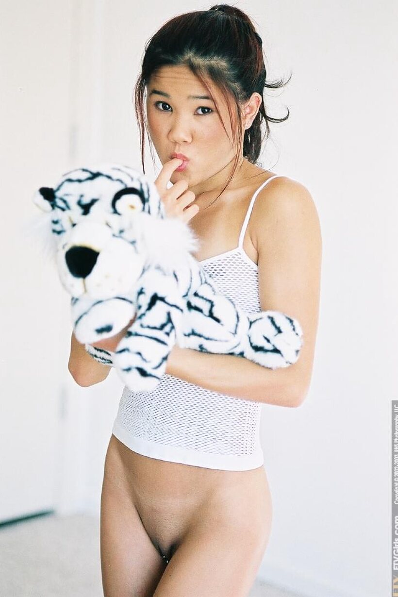 Kitty Jung pic 15 from the set «Asian Kitty Jung up close: natural tits and pussy outdoors»