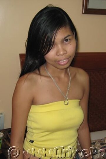 On the bed, an Asian amateur goes fully nude in her bedroom