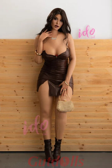 Leather dress drops away as a hot brunette sex doll shows off her tight ass