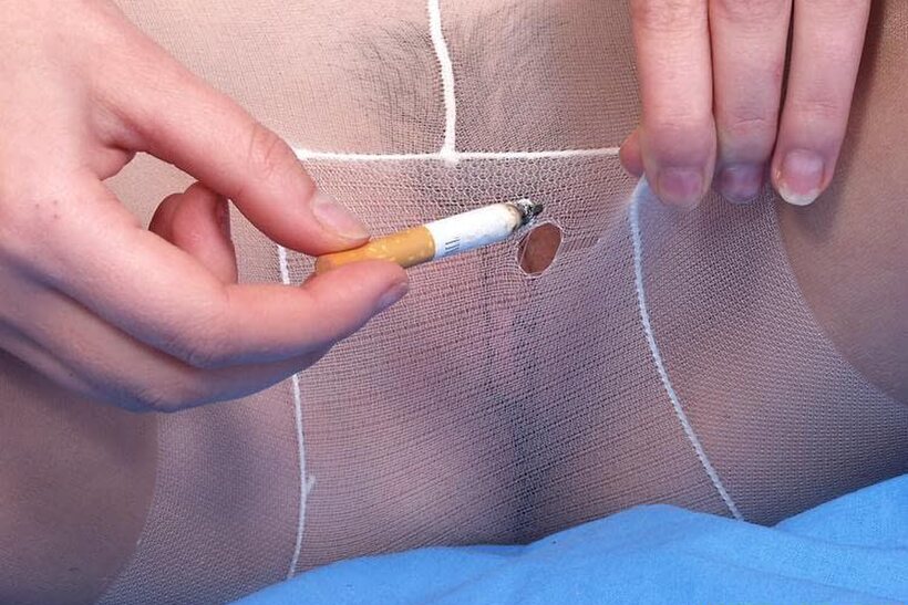 Skinny teen smokes while she slips her tits and pussy out of pantyhose, photo 2 of 15