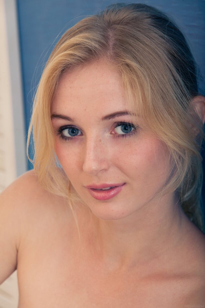Image 14/21: Leona Honey gets naked to display her shaved pussy and blonde hair