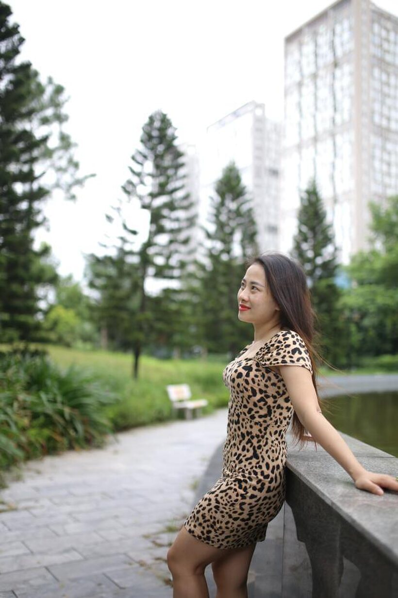 Photo 4 — Asian girl strips out of her skirt and poses naked