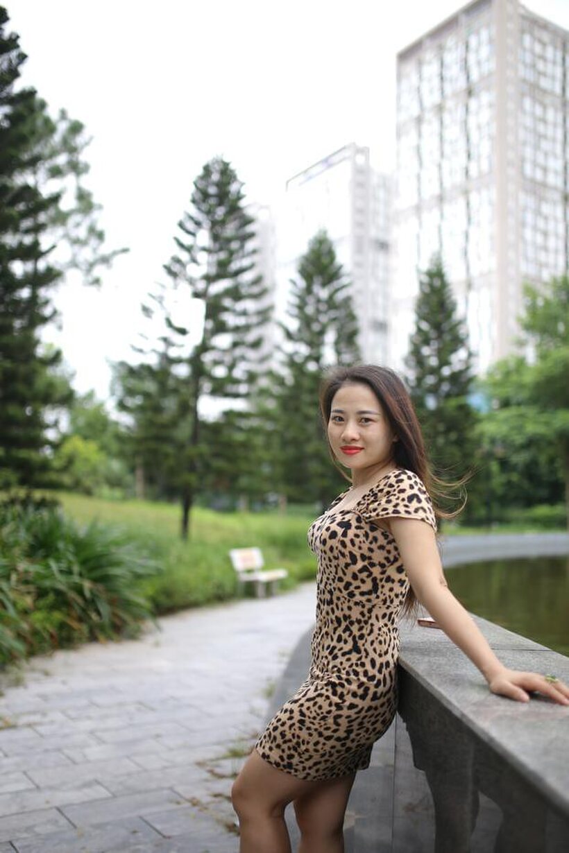 Photo 6 — Asian girl strips out of her skirt and poses naked
