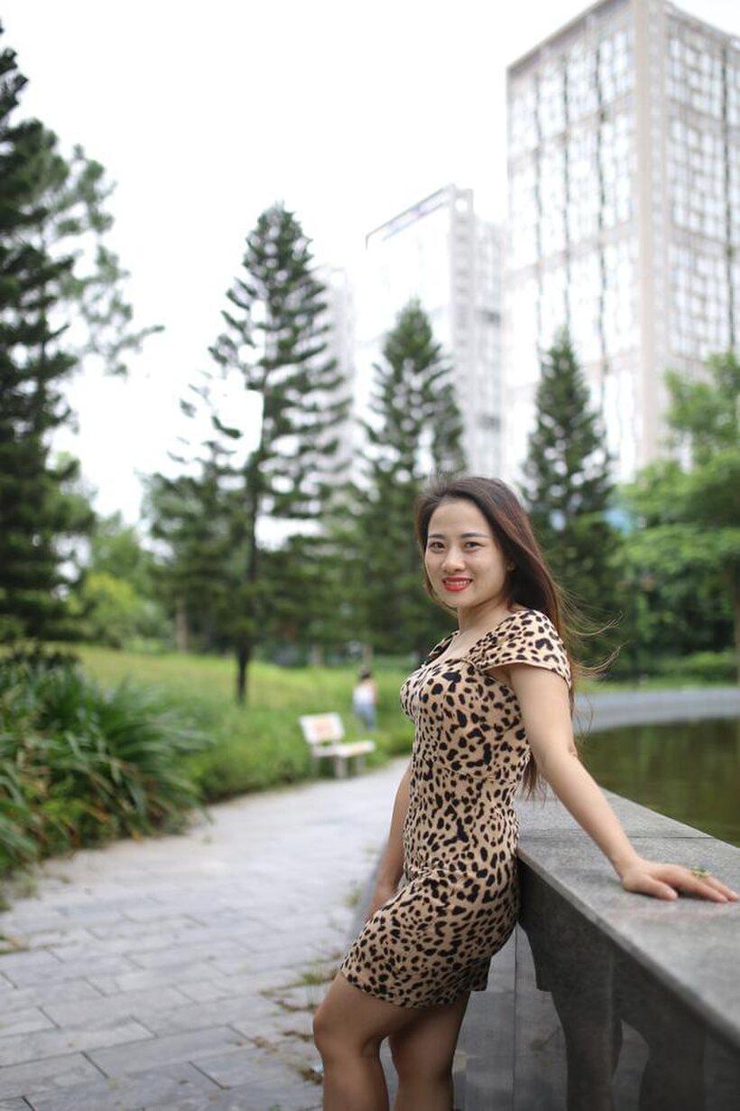 Image 8/21: Asian girl strips out of her skirt and poses naked