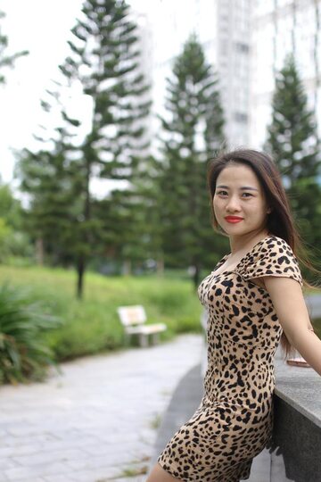Asian girl strips out of her skirt and poses naked