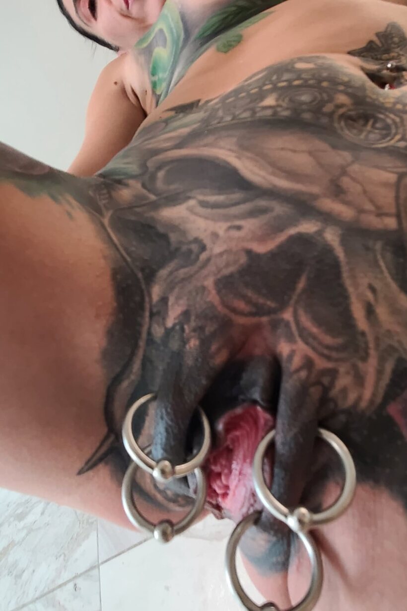 Marie Bossette nude photo 3 — Tattooed Marie Bossette poses with her small fake tits on display in the shower