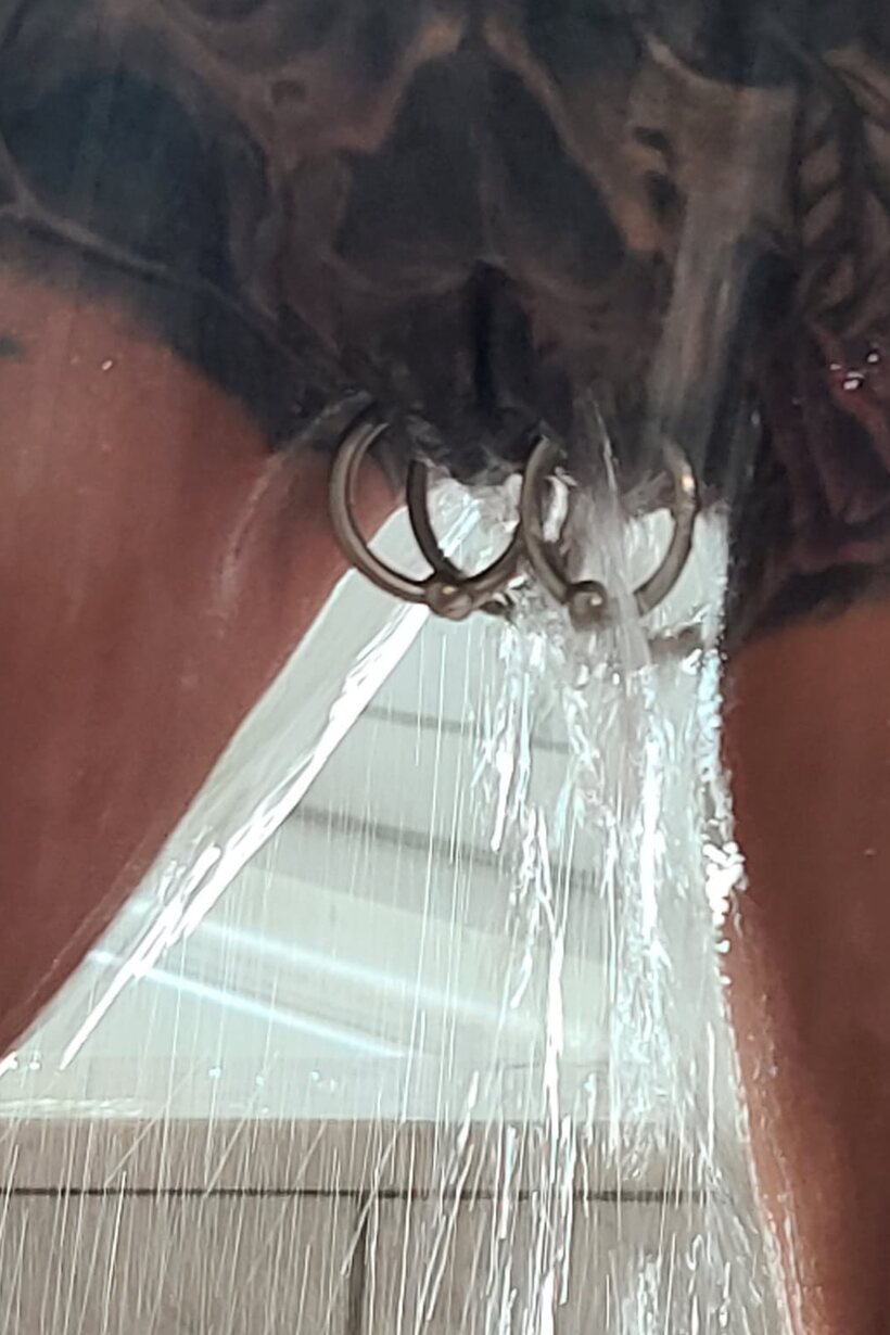 Tattooed Marie Bossette poses with her small fake tits on display in the shower, photo 12 of 16