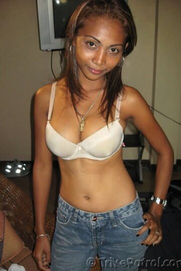 Beautiful girl poses with her big tits on display in panties
