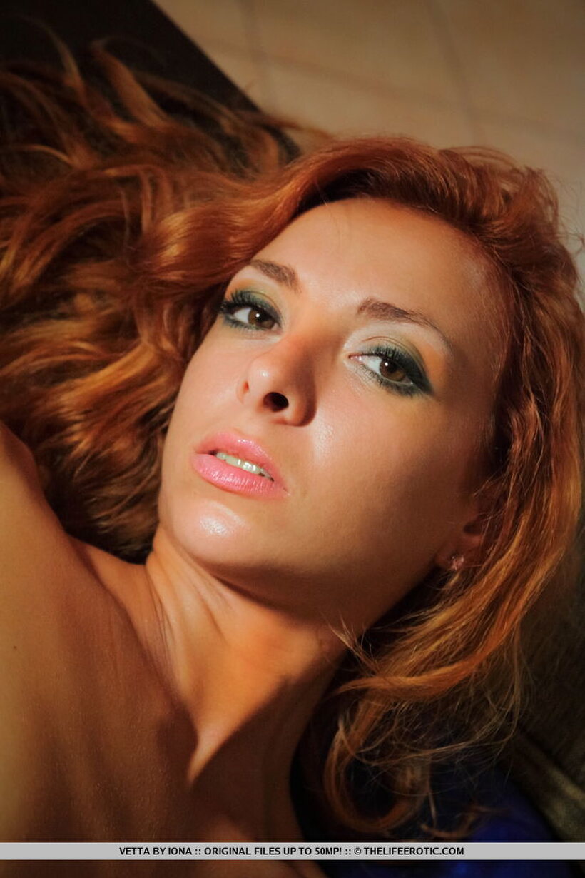 Photo 13 — Mesh glove hides her face as a skinny redhead plays solo
