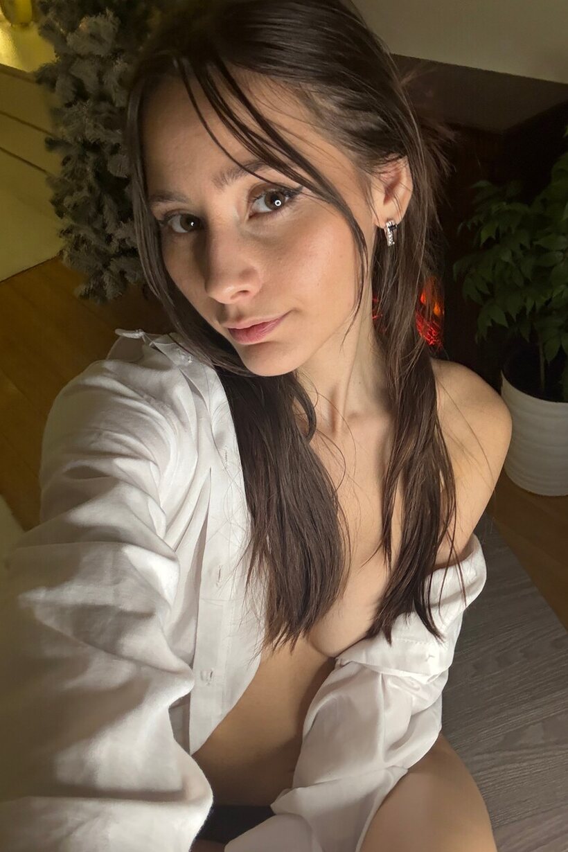 Photo 1 — Amateur girl strips out of lingerie and licks her lips seductively