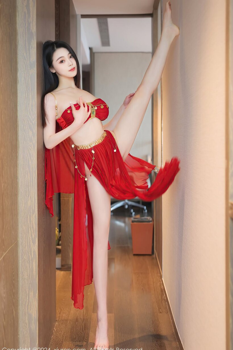 Asian babe hikes up her red skirt to show off ass (shot 1)