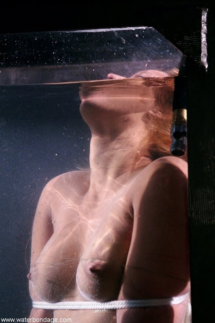 Isis Love gets her pussy rubbed during water tank bondage (shot 20)