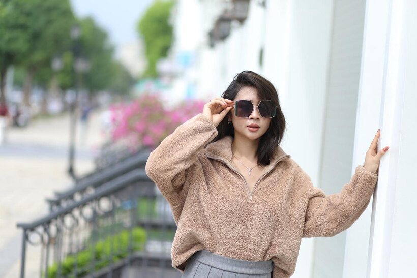 Sexy girl in glasses shows her legs outdoors (shot 4)