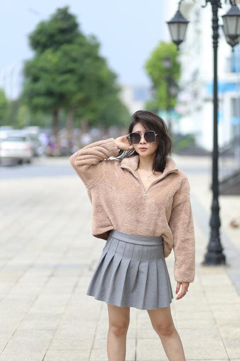 Sexy girl in glasses shows her legs outdoors, photo 10 of 21