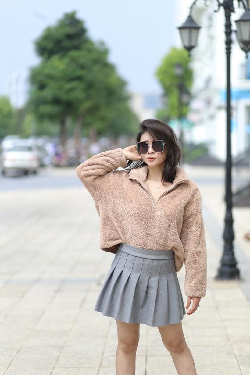 Image 11/21: Sexy girl in glasses shows her legs outdoors