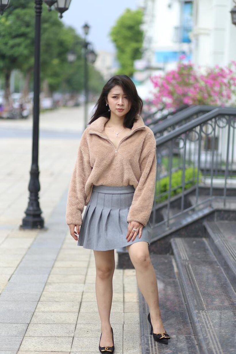 Image 18/21: Sexy girl in glasses shows her legs outdoors