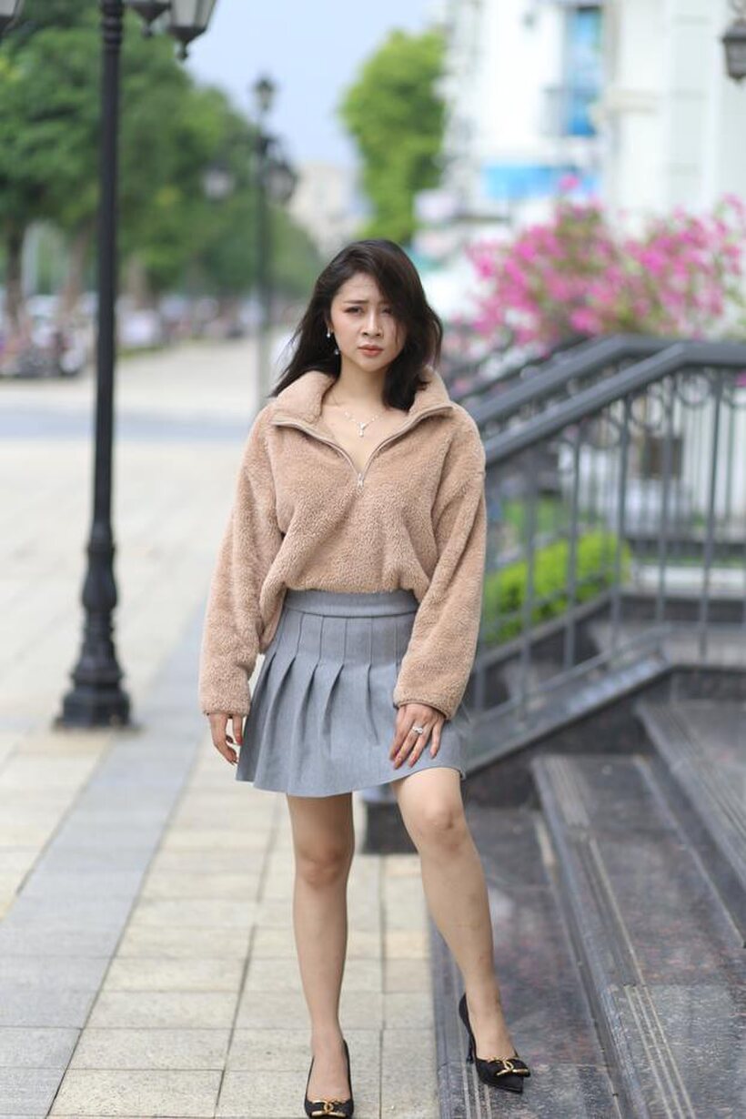 Image 19/21: Sexy girl in glasses shows her legs outdoors