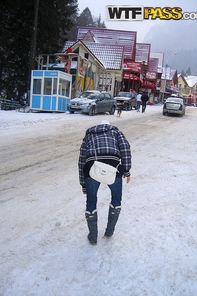 Image 4/16: Amateur couple snaps selfies during a visit to a snowy town