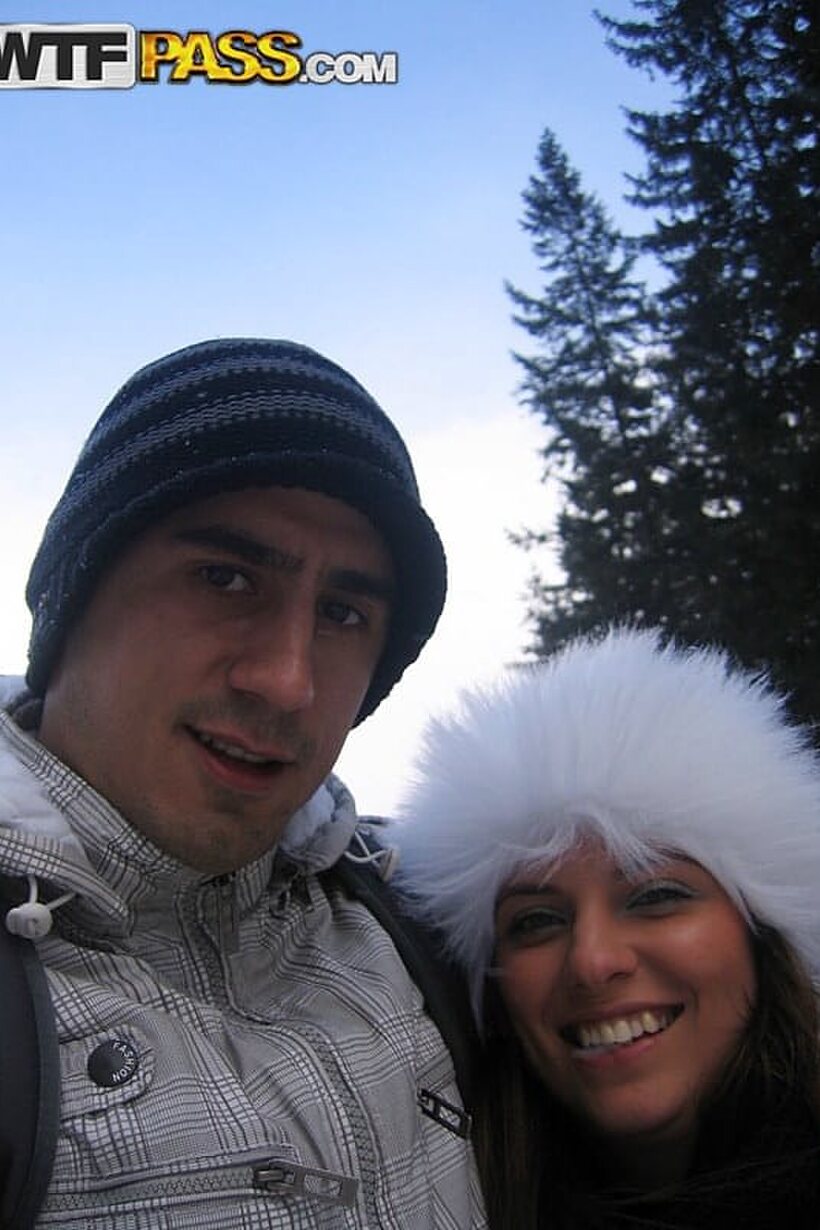 Image 7/16: Amateur couple snaps selfies during a visit to a snowy town
