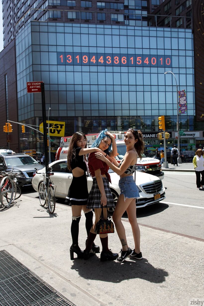 Image 1/12: Skye Blue and her girlfriends strike sexy poses in public wearing skimpy outfits