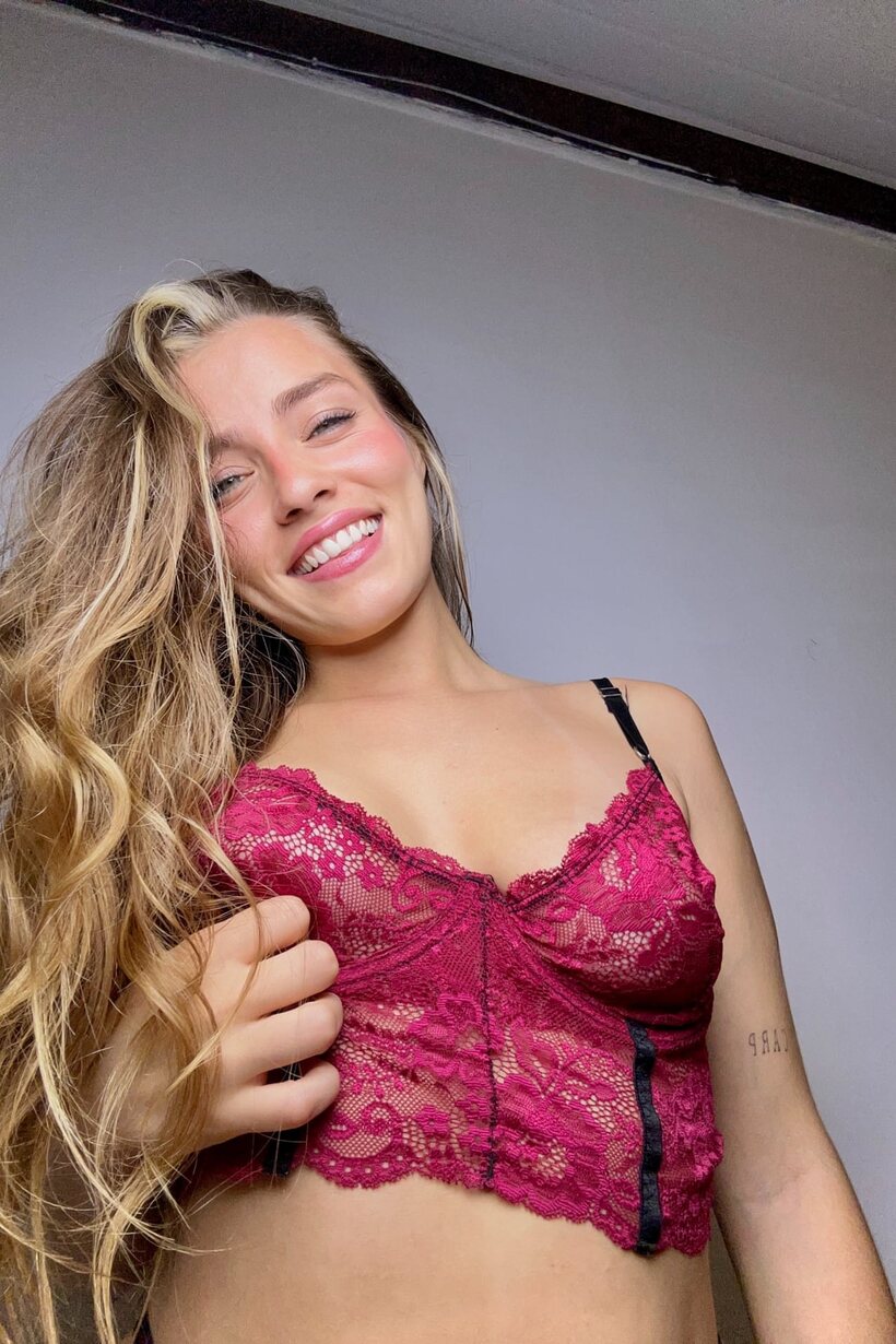 Photo 2 — Blonde girl poses with her natural tits on display