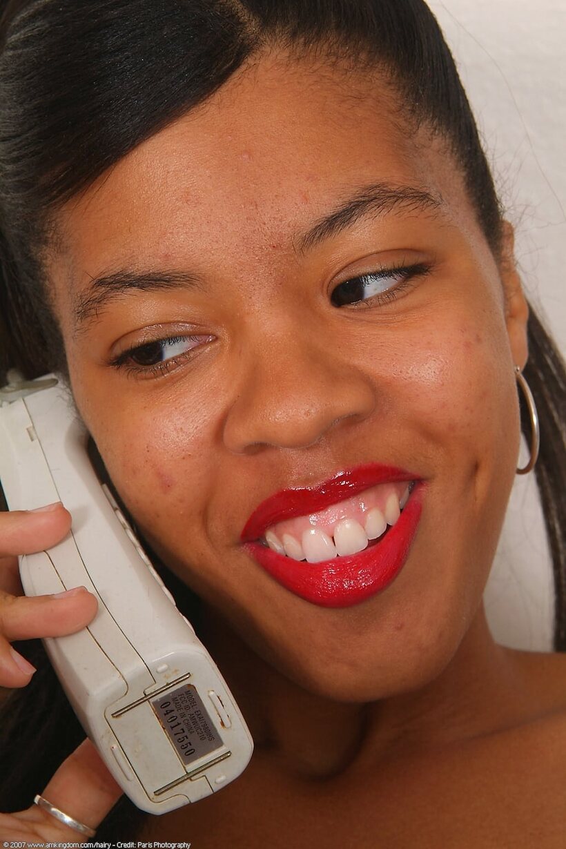 African pic 3 from the set «Spreading her pussy on a payphone, cute black teen with red lips»