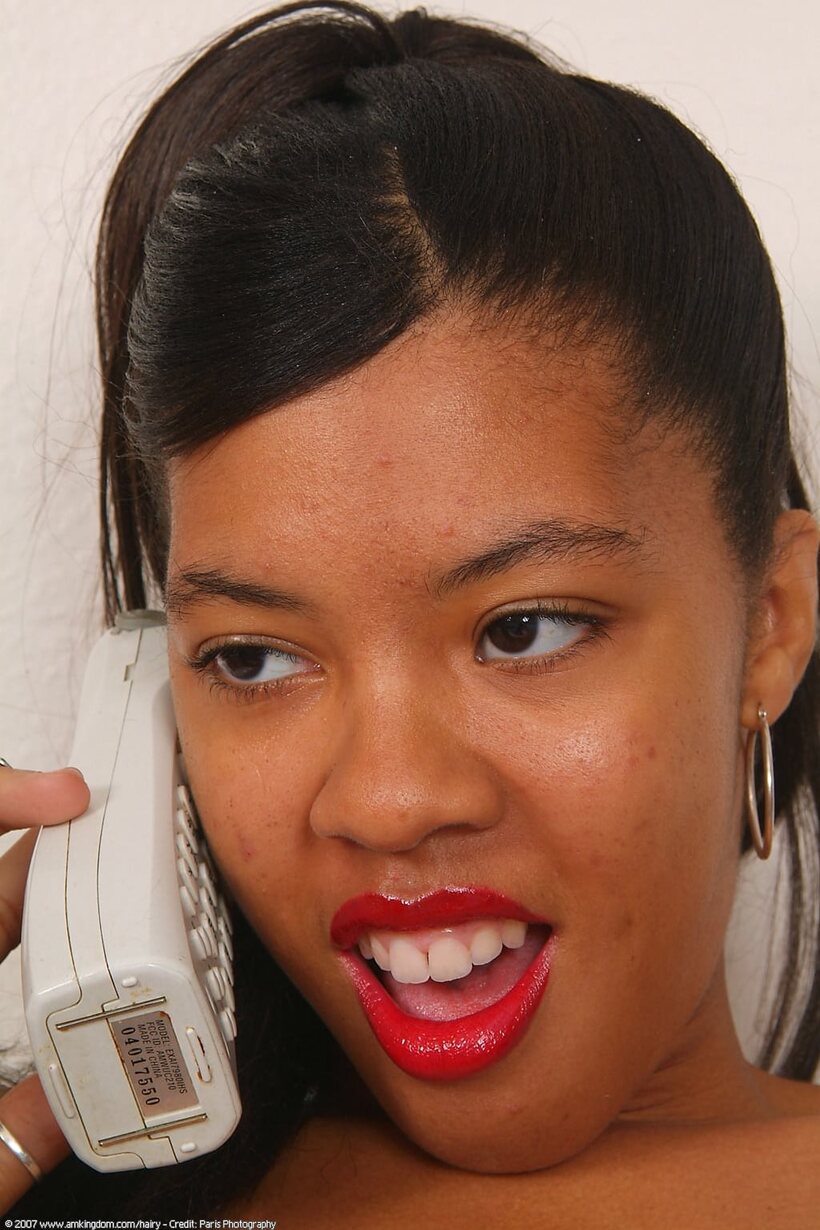 African pic 8 from the set «Spreading her pussy on a payphone, cute black teen with red lips»
