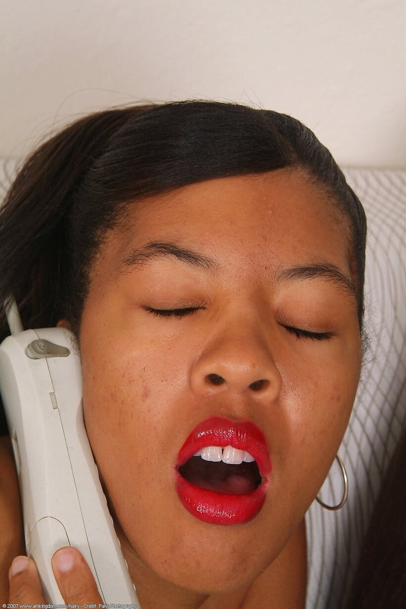 African pic 17 from the set «Spreading her pussy on a payphone, cute black teen with red lips»