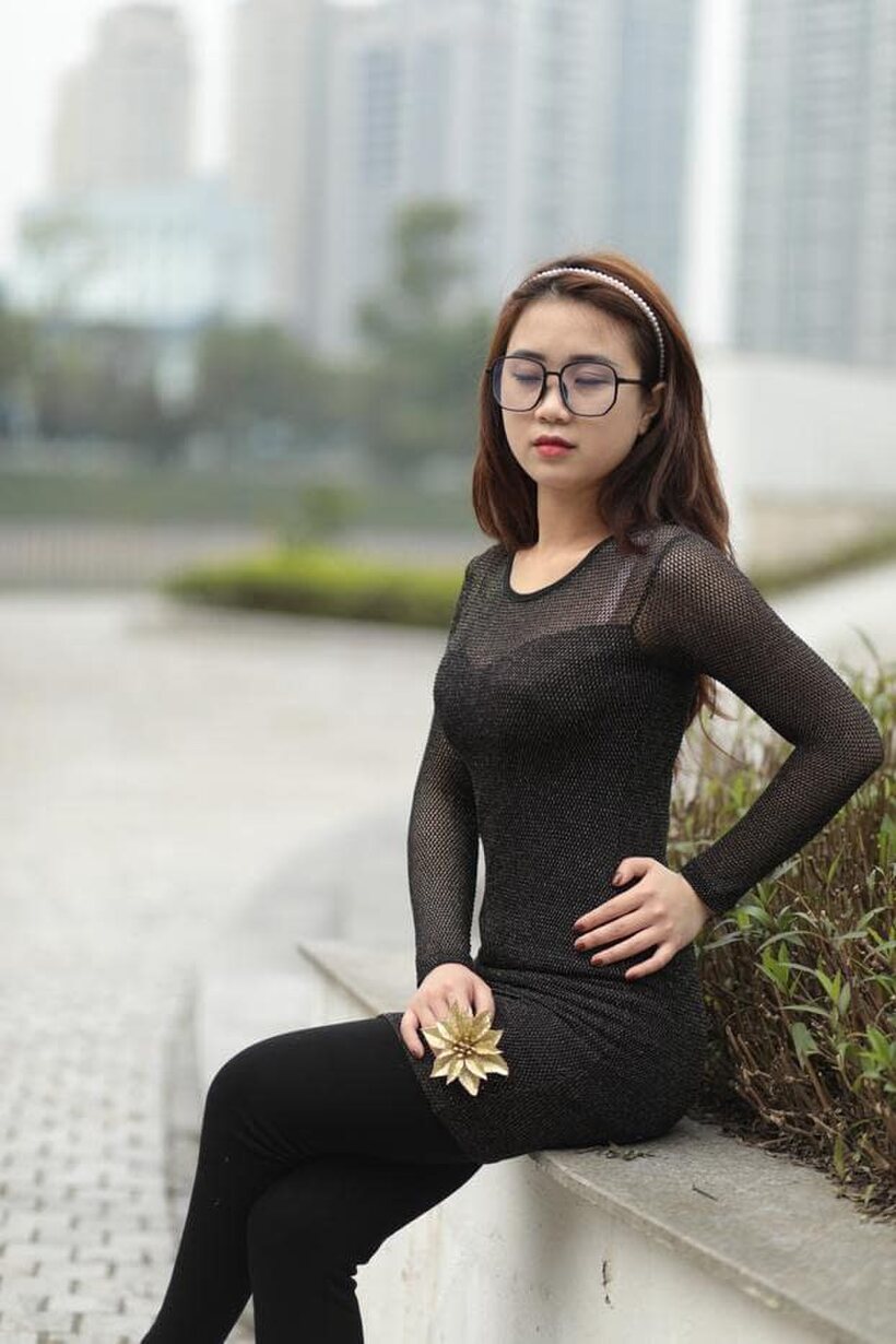 Image 6/21: Asian babe in glasses shows off her tight outfit outdoors