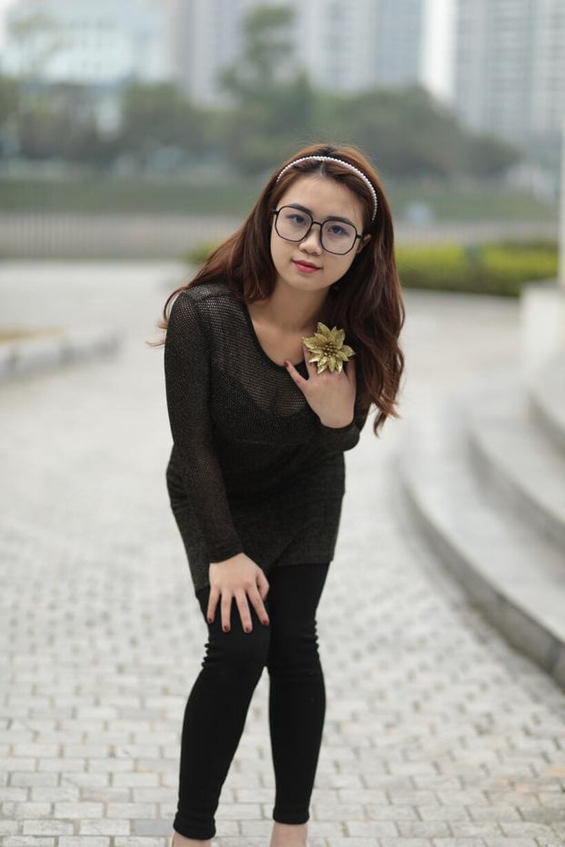 Asian babe in glasses shows off her tight outfit outdoors (shot 15)