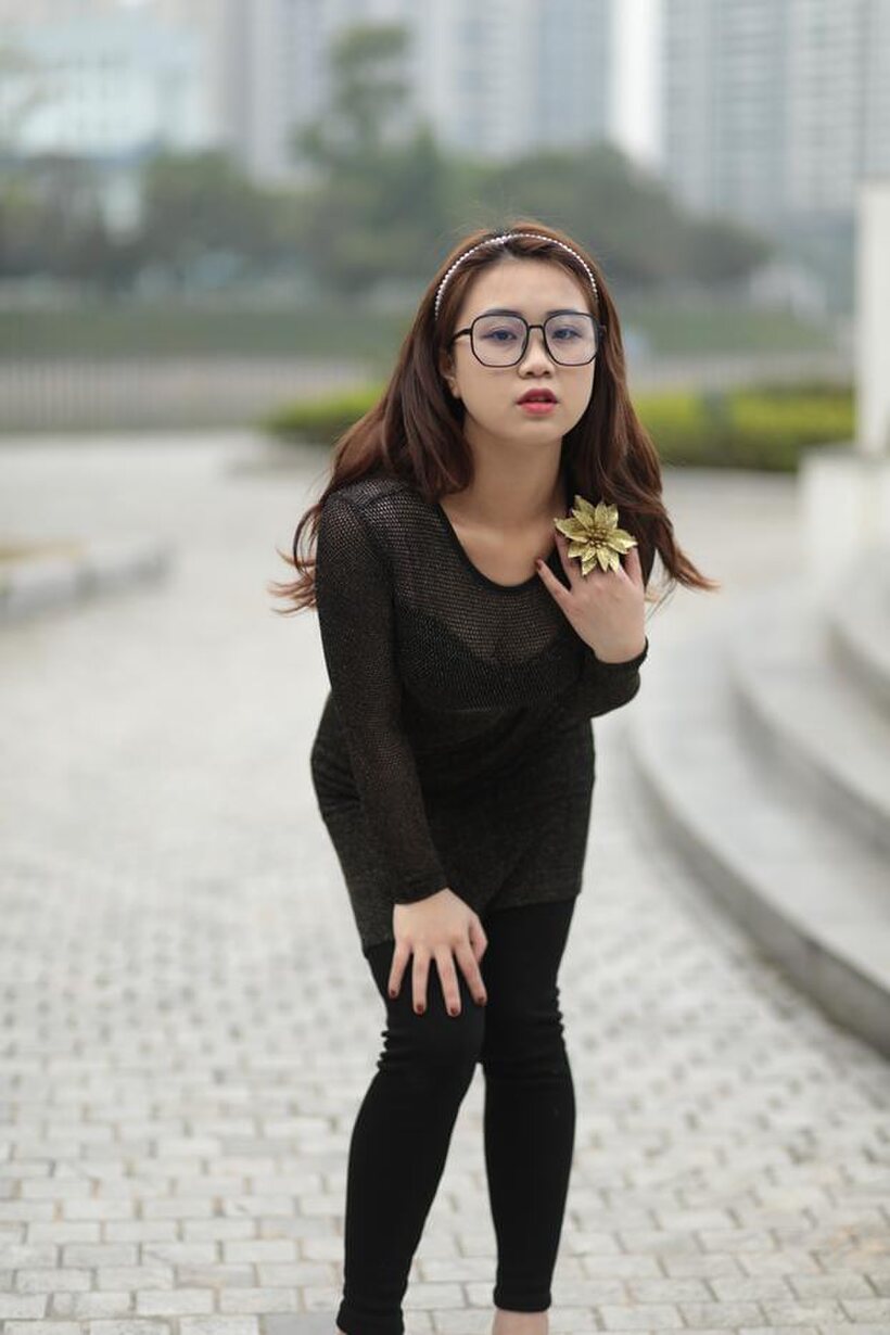 Photo 16 — Asian babe in glasses shows off her tight outfit outdoors