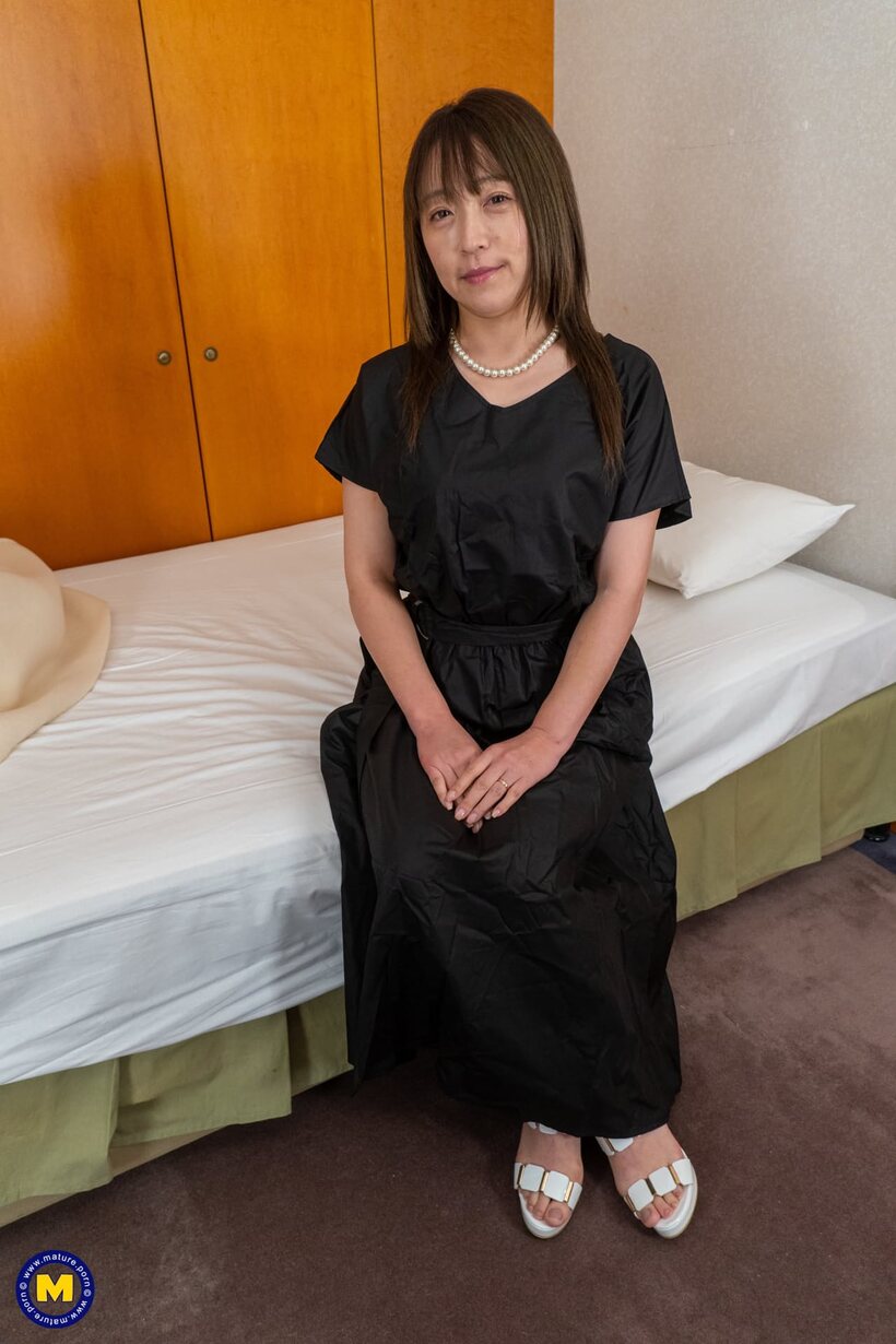 Image 8/20: Asian Shiho Aoyama exposes her hairy pussy and ass while undressing