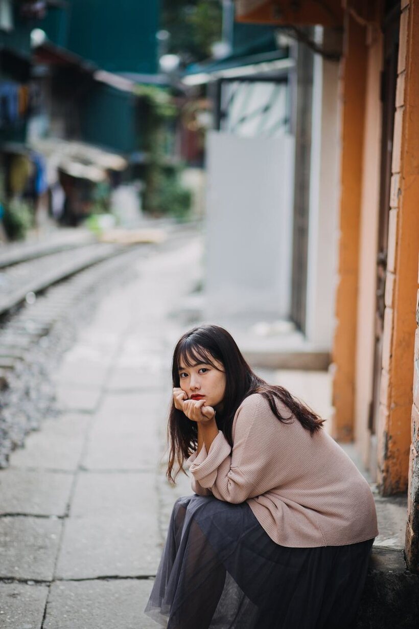 Photo 4 — Posing on the railroad, this gorgeous Asian model shows off her outfit