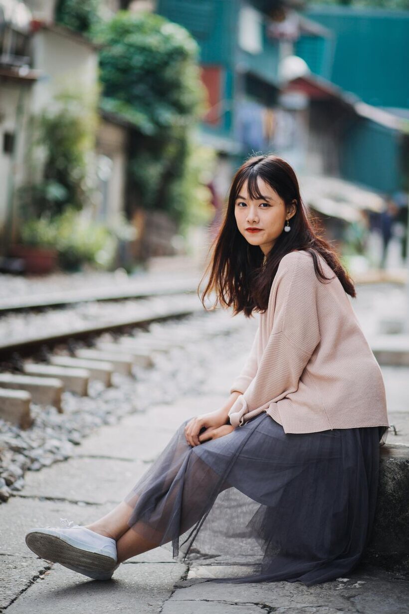 Photo 5 — Posing on the railroad, this gorgeous Asian model shows off her outfit